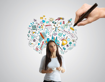 Hand drawing  sketch on grey background with female drinking coffee. Creative business idea conceptの写真素材