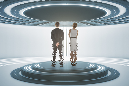 Back view of businessman and woman inside abstract teleportation sation. Future technologies concept. 3D Renderingの写真素材