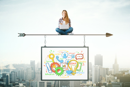 Woman sitting on abstract arrow with suspended business sketch. City background. Mock up. Profit conceptの写真素材