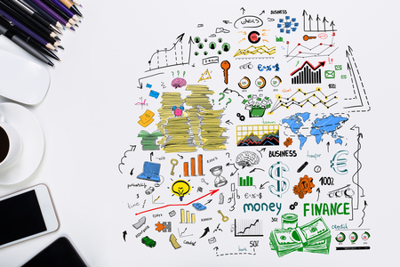 Top view of white office desktop with colorful business sketch, supplies, electronic devices and other items. Success conceptの写真素材