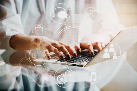 Woman using laptop with creative digital pattern. Communication conceptの写真素材