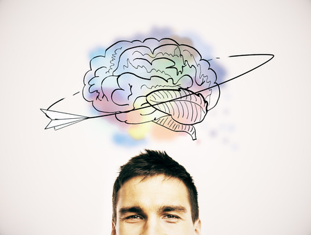 Half portrait of cheerul young european man with creative brain sketch above head. Brainstorm...
