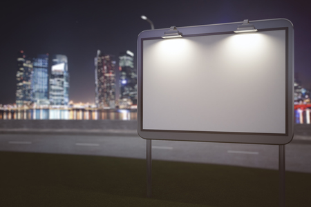 Front view of empty ad banner on night city background. Commerce concept. Mock up, 3D Renderingの写真素材