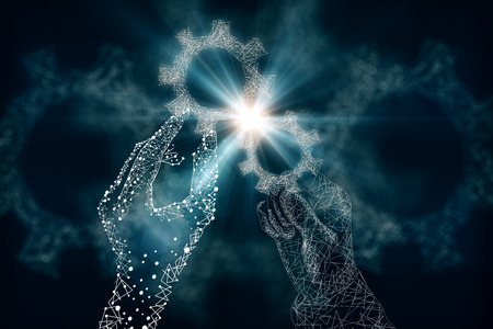 Close up of creative polygonal hands holding blue cogwheels on dark background. Tech concept. 3D Renderingの写真素材