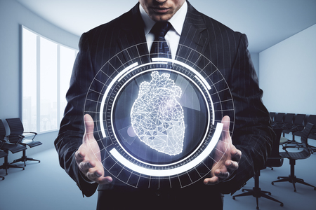 Businessman holding abstract digital circle with polygonal heart in interior. Health concept. 3D Renderingの写真素材