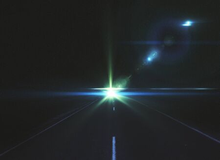 Dark road with bright light. Future and imagination conceptの写真素材