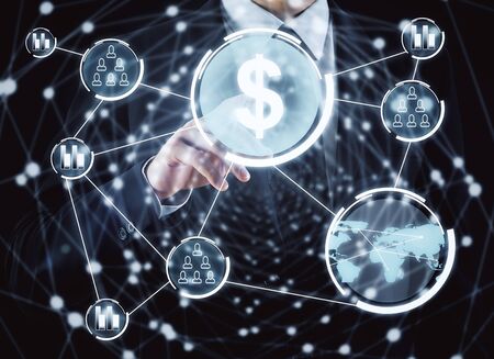 Businessman pointing at abstract digital business dollar hologram. Technology and finance concept. Double exposureの写真素材