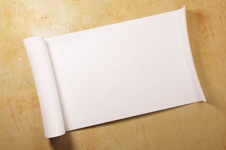 Empty white parchment scroll on light wooden background with shadow. Document, paper, design concept. Mock up, 3D Renderingの写真素材