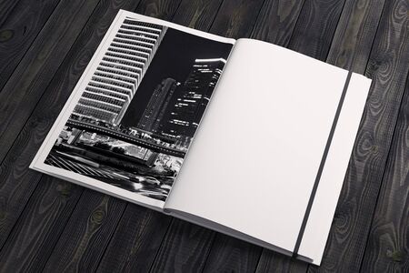 Creative hardcover textbook with city image and empty pages, placed on wooden desktop. Creativity,...