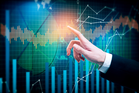 Pointing hand on creative business chart background. Forex conceptの写真素材