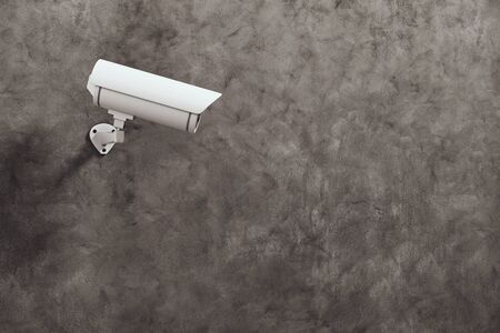 White CCTV camera on concrete wall background with copyspace. Supervision concept. 3D Rendering