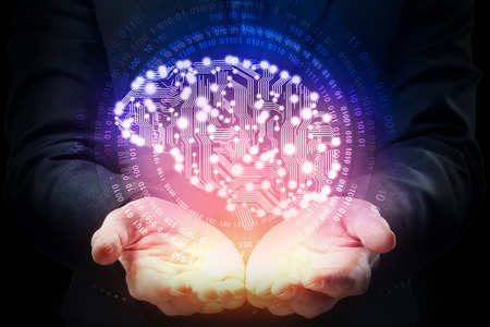 Businessman hands holding abstract circuit brain on dark background. Artificial intelligence concept