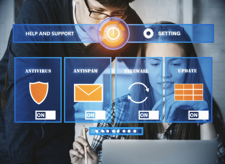 Businessman and woman using laptop withj antivirus interface. Hacker concept