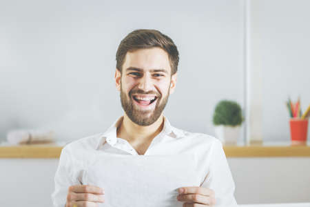 Close up portrait of happy businessman at workplace. Lifestyle conceptの写真素材