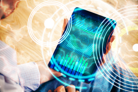 Businessman using tablet with abstract digital hologram. Innovation conceptの写真素材