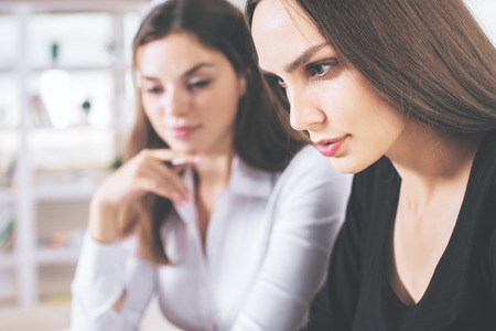 Close up portrait of two beautiful european businessladiesの写真素材