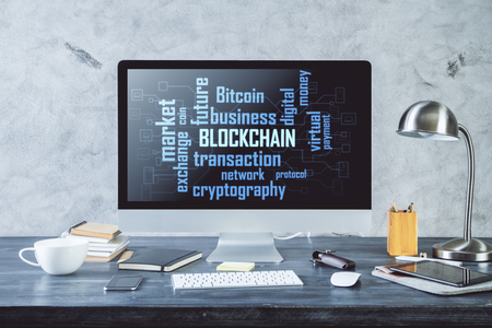Front view of creative designer desktop with blockchain text on computer screen. Digital market conceptの写真素材