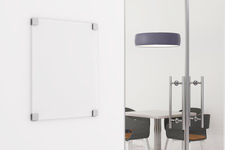 Clean glass poster on white concrete wall of office interior. Advertising concept. Mock up, 3D Renderingの写真素材