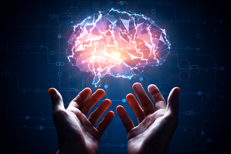 Male hands holding abstract glowing polygonal brain on blue background with digital circuit. Artificial intelligence concept. 3D Renderingの写真素材
