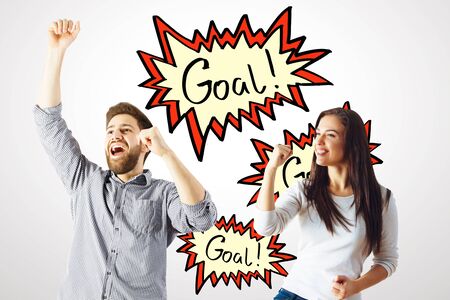 Excited young man and woman celebrating success on white wall background with exclamation comic...