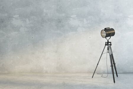 Concrete interior with professional lighting equipment and empty wall. Gallery, museum, exhibition concept. Mock up, 3D Renderingの写真素材