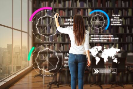 Woman drawing abstract environmental interface in modern interior. Environment and green concept. 3D Rendering の写真素材