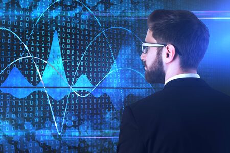Side portrait of attractive young businessman looking at abstract binary code interface with chart....