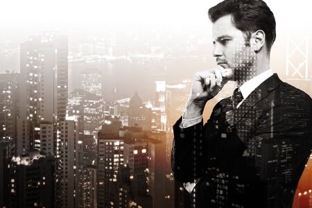 Side portrait of handsome young businessman on abstract night city background with copy space. Success and research concept. Double exposure の写真素材