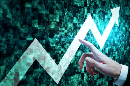 Hand pointing at glowing upward arrow on abstract green web tile background. Success and growth...