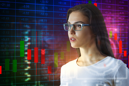 Side portrait of attractive european woman in glasses standing on abstract glowing forex chart...