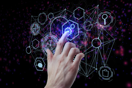 Hand pointing at abstract digital business hologram on black background. Media and interface concept. 3D Rendering の写真素材