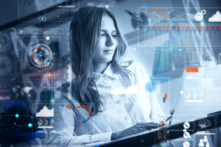 Young businesswoman working on project in modern office with abstract forex chart. Filtered image....