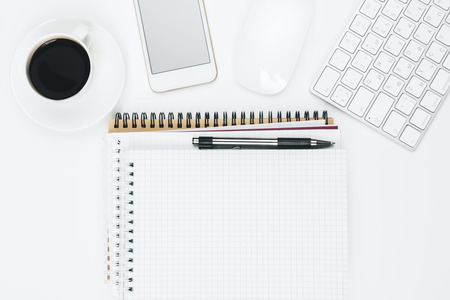 Top view and close up of creative office desk with blank cellphone, various supplies and other items. School, education, technology and advertisement concept. Mock upの写真素材