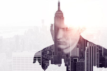 Portrait of handsome young businessman on abstract New York city background with copy space. Double exposure の写真素材