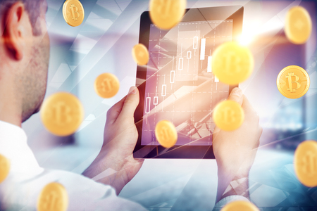 Close up of businessman using abstract tablet with bitcoin. Cryptocurrency and payment conceptの写真素材