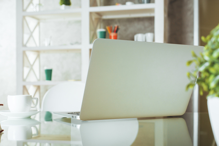 Close up of creative designer desktop with open laptop turned away. Mock up の写真素材