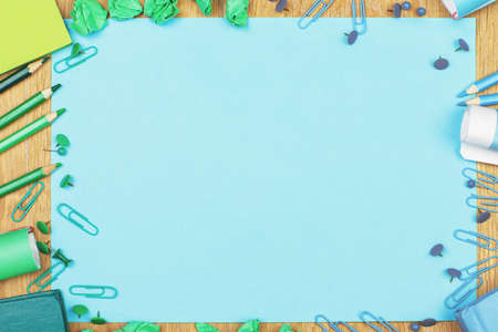 Top view of wooden desktop with colorful supplies and copy space. Mock upの写真素材