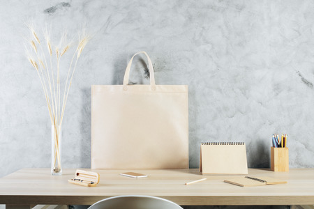 Office desktop with shopping bags, supplies and other items. Packaging, market and business concept. Mock upの写真素材