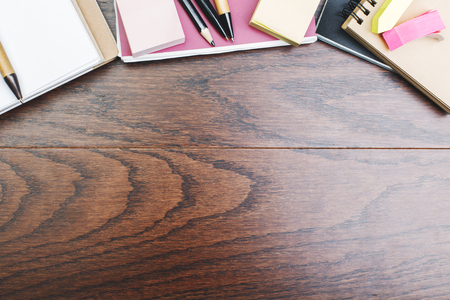 Top view of creative wooden royal oak office workspace with colorful supplies and copy space. Work place and art concept. Mock up の写真素材