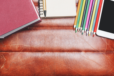 Top view of modern leather desktop with supplies, other items and copy space. Mock upの写真素材