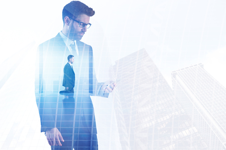 Businessman on abstract city office background. Success and communication concept. Double exposure の写真素材