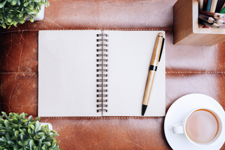 Top view of modern leather table with supplies, other items and copy space. Mock upの写真素材