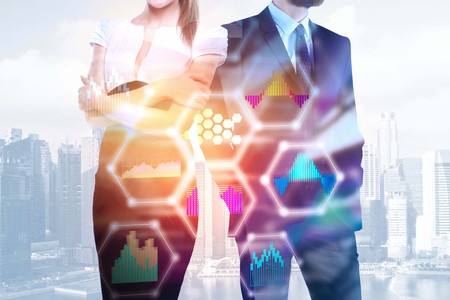 Businessman and woman standing on abstract city background with blurry digital business interface and sunlight. Teamwork and analysis concept. Double exposure の写真素材