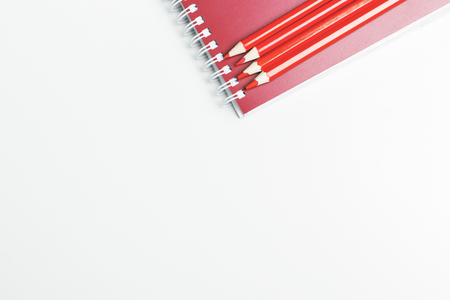 Top view of modern white office desk top with notepad and other supplies. Mock upの写真素材