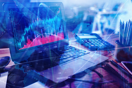 Close up of laptop with abstract forex chart. Finance and trade concept. Double exposure 