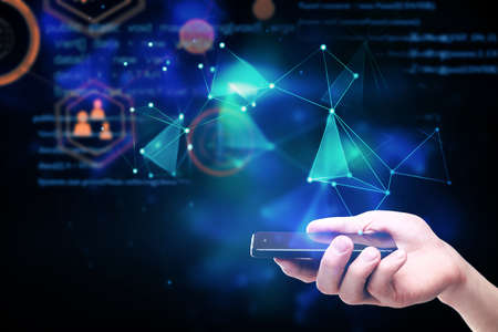 Hand holding smartphone with digital interface. Technology and communication concept. Double...