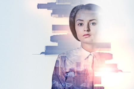 Portrait of attractive young woman on abstract city background. Double exposure の写真素材