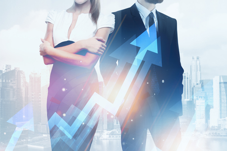 Businessman and woman standing on abstract city background with glowing digital arrows. Teamwork and growth concept. Double exposure の写真素材