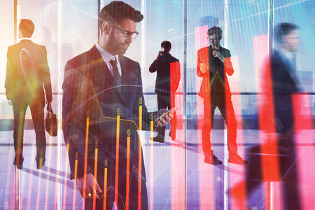Businesspeople silhouettes in modern office interior with forex chart. Meeting, teamwork, finance and finance concept. Double exposure の写真素材