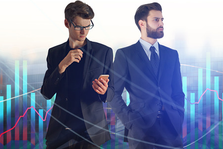 Attractive european businessmen on abstract blurry city background with forex chart. Analysis, investment and trade concept. Double exposure の写真素材